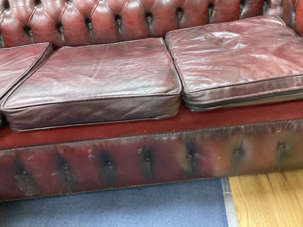 A Victorian style buttoned burgundy leather three seater Chesterfield settee, width 190cm depth 85cm height 72cm